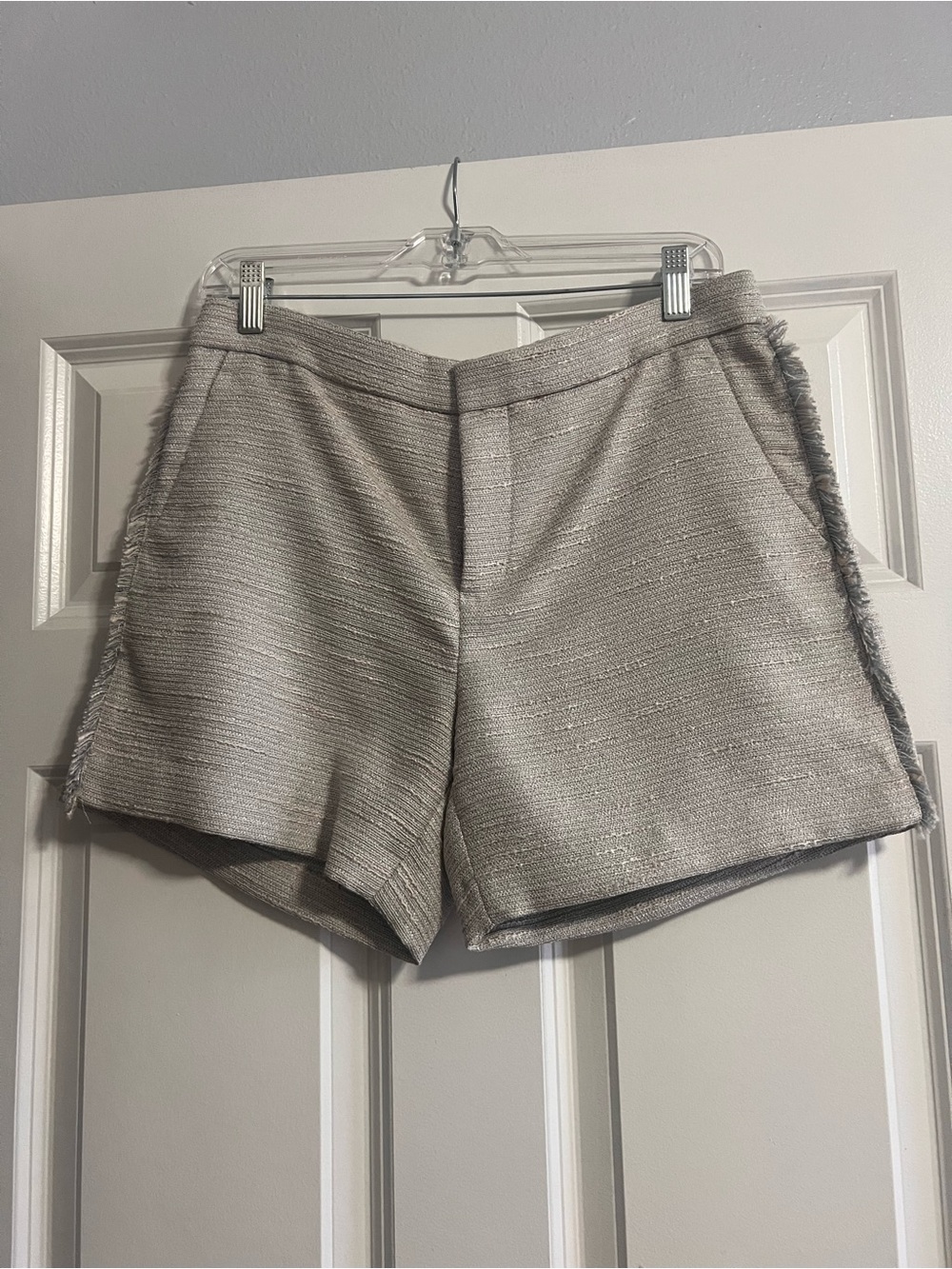 Banana Republic linen shorts laced with shiny threading and fringed threading.